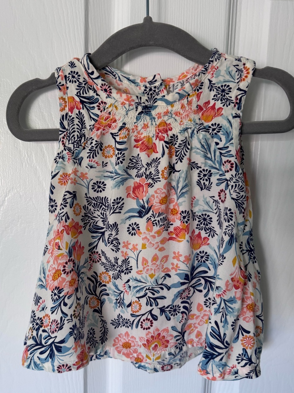Girls floral blouse with orange and blue pattern